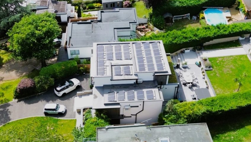 33 Solar panels mounted on a flat roofed residential property