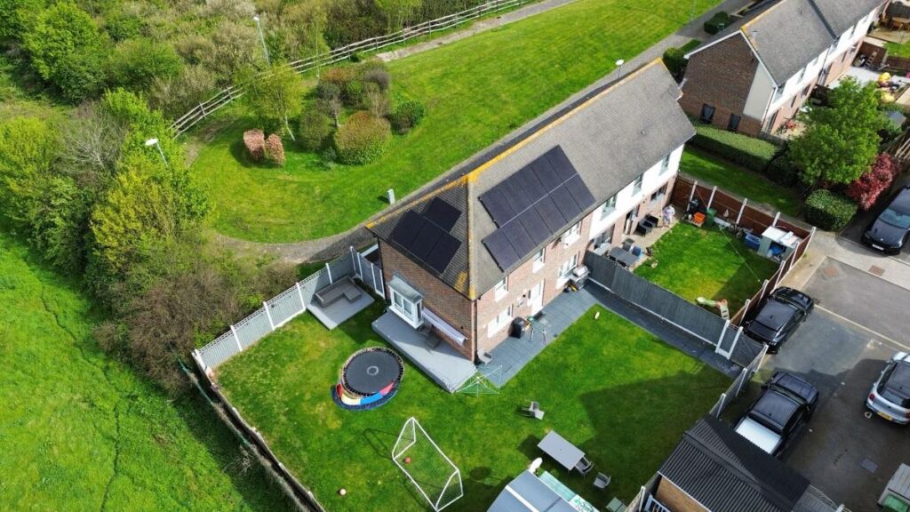 Drone image of residential roof mounted solar panel installation