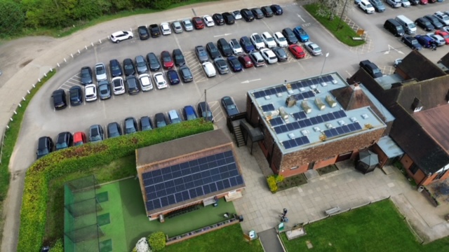 Drone photo of solar panel installation on a local golf club. 142 Solar Panels fitted to a flat roof with pitched mounting system