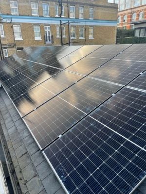 Solar panels for offices. Roof mounted solar installed on a London HQ office building.