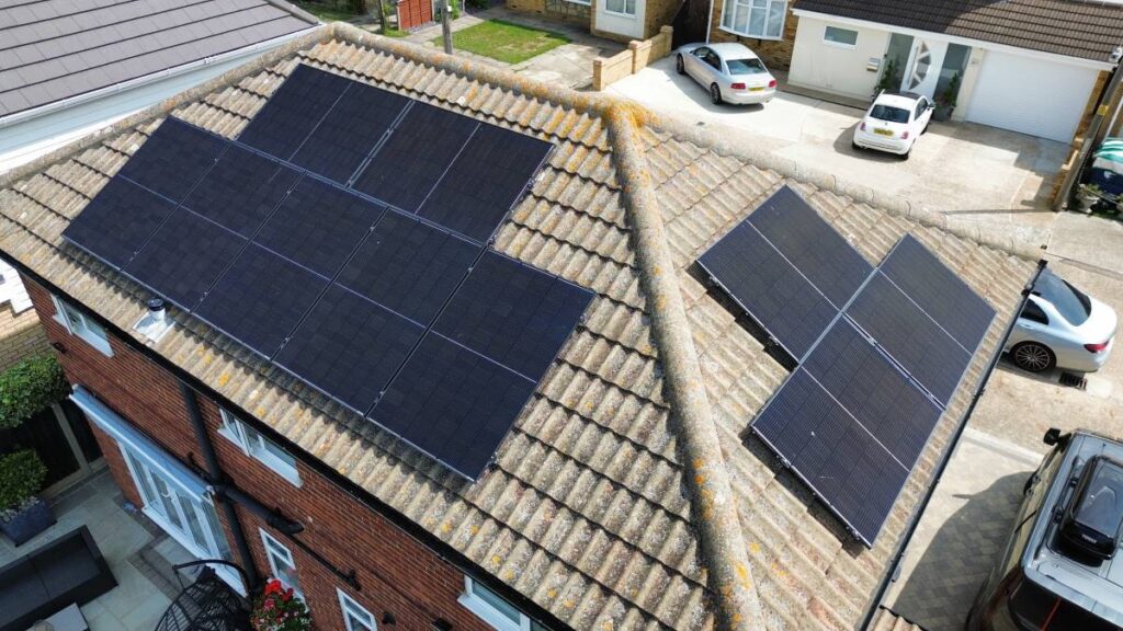 Drone photograph of roof mounted solar panels on a house.