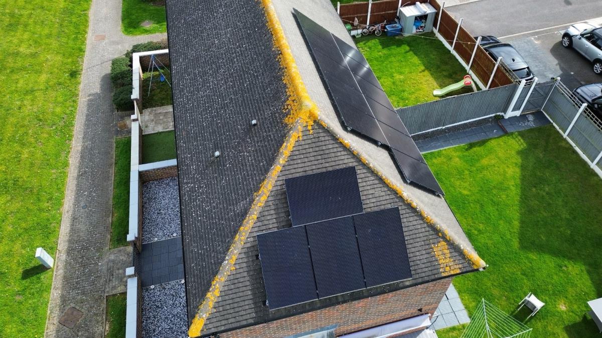 Drone image of residential roof mounted solar panel installation