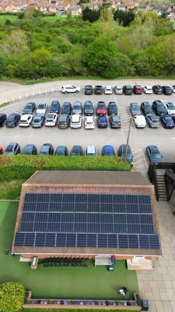 Drone photo of solar panel installation on a local golf club. 142 Solar Panels fitted to a flat roof with pitched mounting system