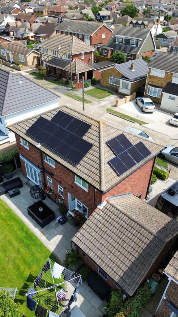 Drone photograph of roof mounted solar panels on a house.