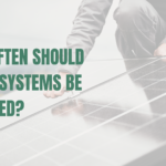 Solar installer on a roof checking panels